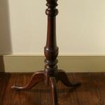 Cherry Candlestand
CT, 18th Century

This mid 18th CenturyCT candlestand in great old surface has a 15" round top over urn & ring shaft that ends in snake feet. Height 27"