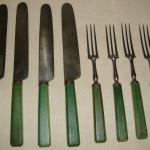 Set of Cutlery, set of four knives and forks with green died bone handles, 19th Century.