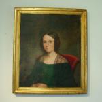 American School Portrait

Oil on canvas portrait of young woman  wearing a green dress and laced shawl. The frame is molded giltwood. 
Circa 1830